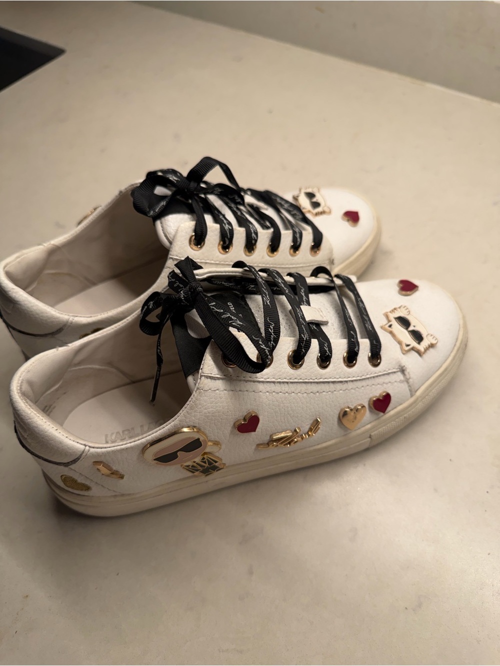 Karl Lagerfeld White Low-Top Sneakers with Gold and Red Embellishments